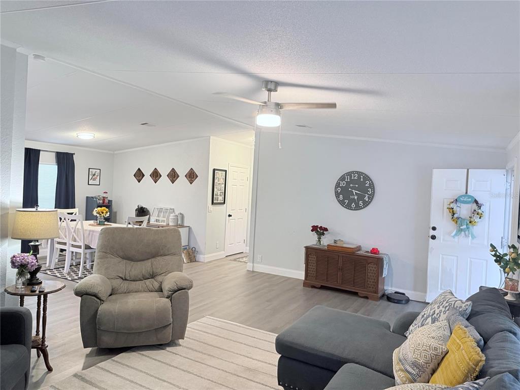 900 Racoon Trail Frostproof, FL 33843 - Photo 13 of 25 a living room with furniture and a couch