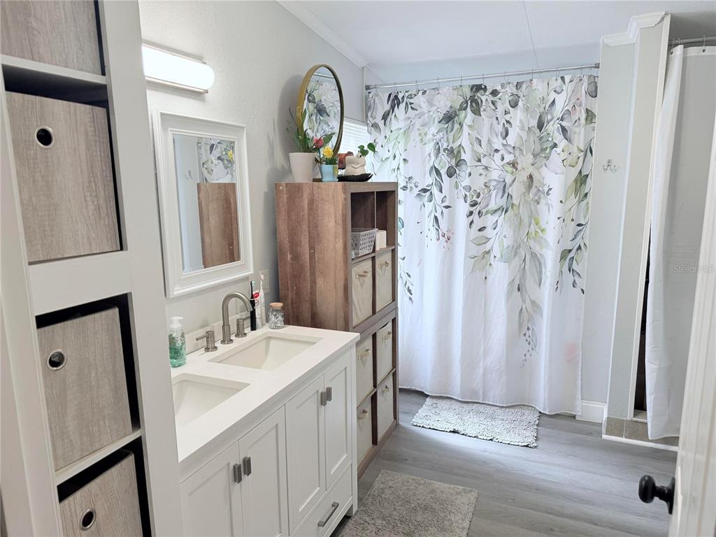 900 Racoon Trail Frostproof, FL 33843 - Photo 17 of 25 a bathroom with a sink and a mirror