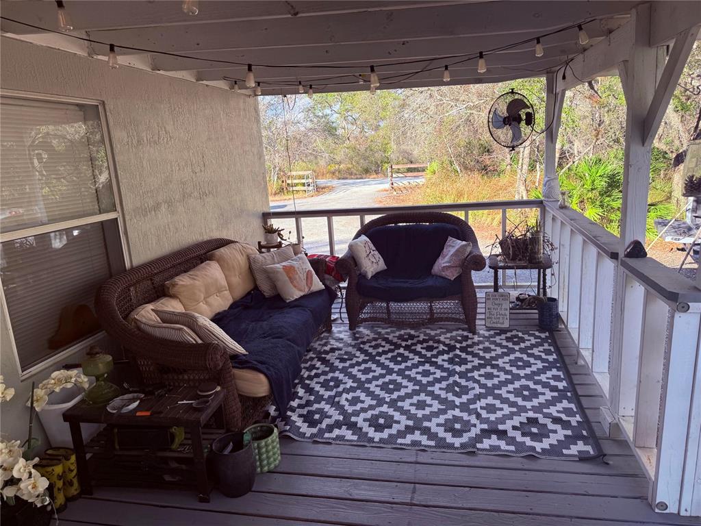 900 Racoon Trail Frostproof, FL 33843 - Photo 9 of 25 a living room with furniture and a large window