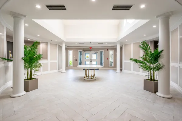 a view of a livingroom with furniture window and wooden floor