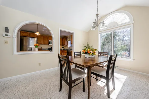 a view of a dining room with furniture window and outside view