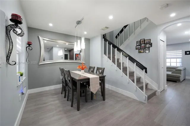 a view of a hallway with furniture and entryway