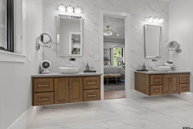 a spacious bathroom with a double vanity sink double and mirror