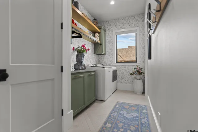 a bathroom with a sink mirror and a shower