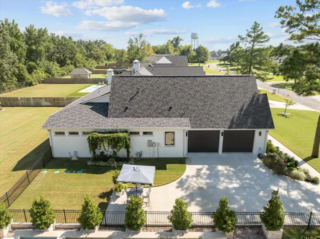 a aerial view of a house with a swimming pool