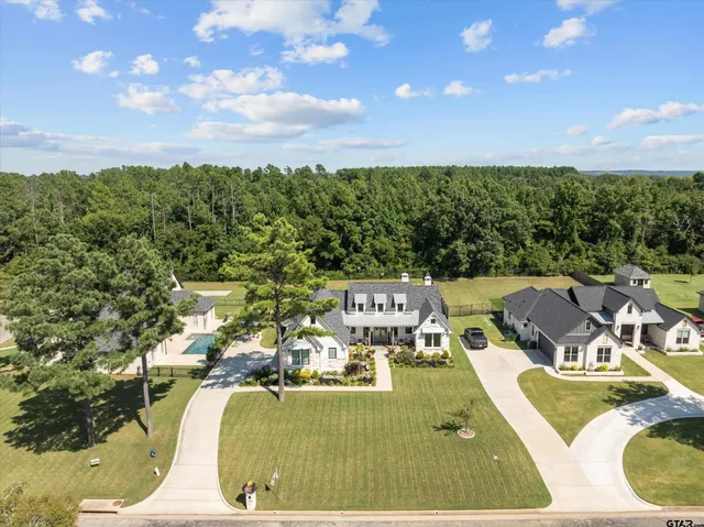 a view of a swimming pool with lawn chairs