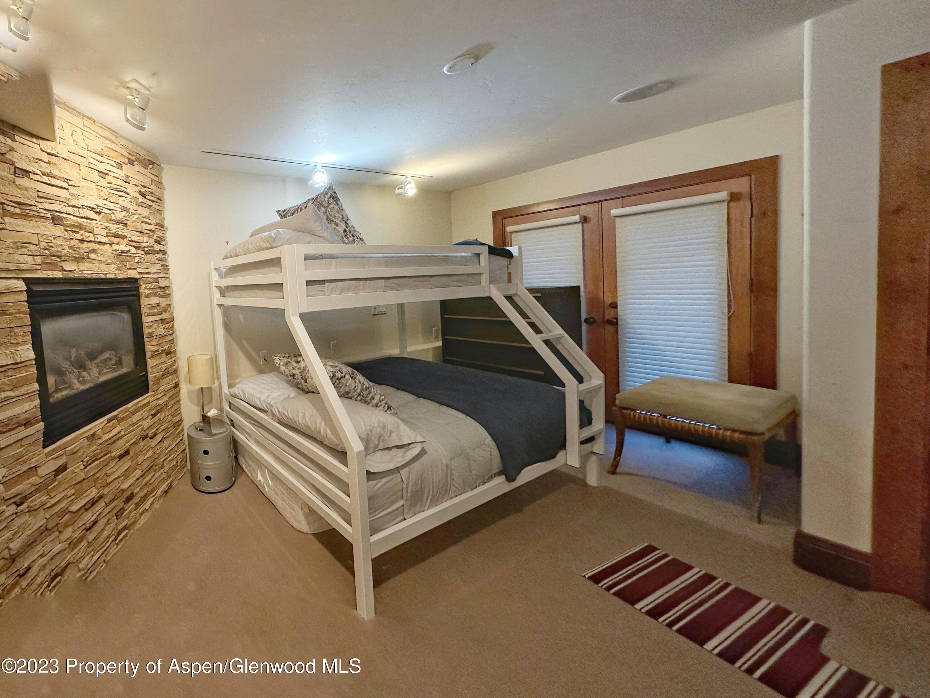 107 Aspen Mountain Road, Unit 5 Aspen, CO 81611 - Photo 9 of 13 Downstairs Guest Bunk Room