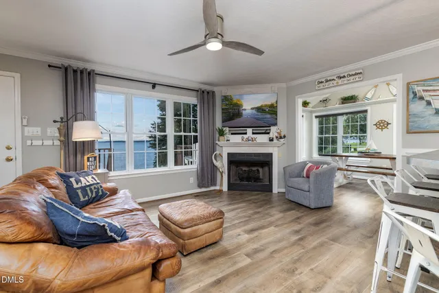 a view of a dining room with furniture wooden floor and a rug