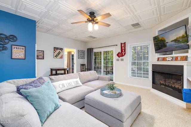 a view of a couches in the patio next to a yard