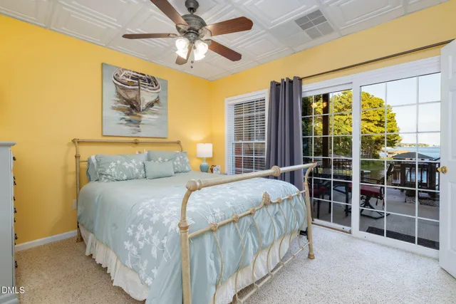 a view of a chairs and table in backyard of the house