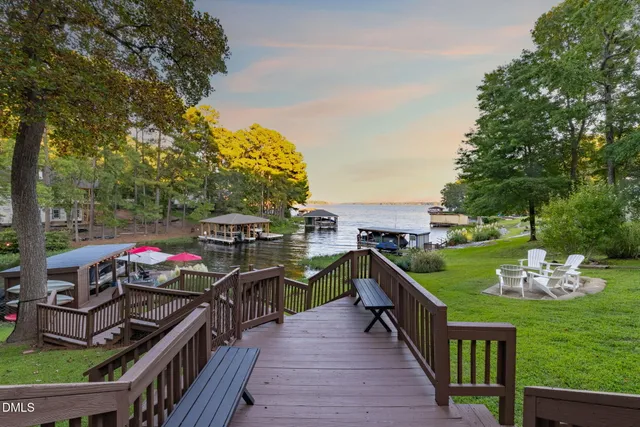 a view of two chairs in the balcony
