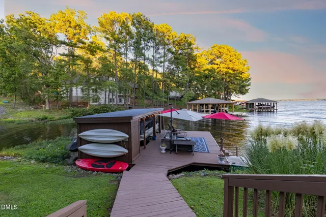 a view of a house with a yard and garden