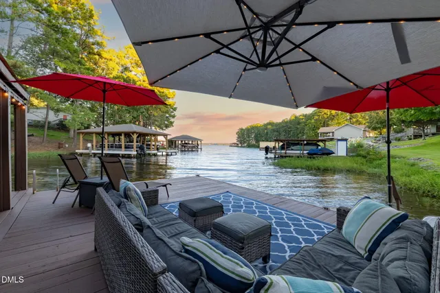 a aerial view of a house with table and chairs and a yard