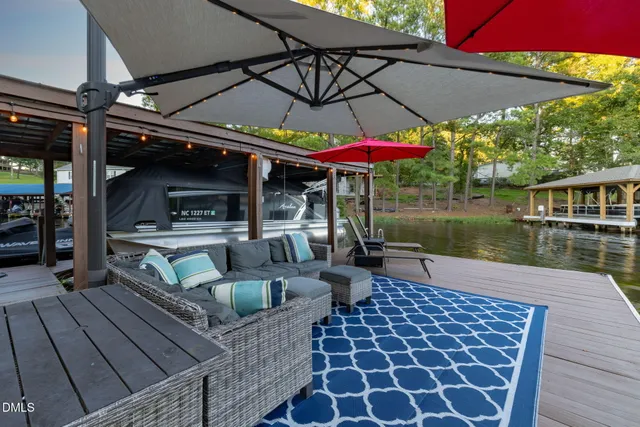 an aerial view of green landscape with trees houses and mountain view