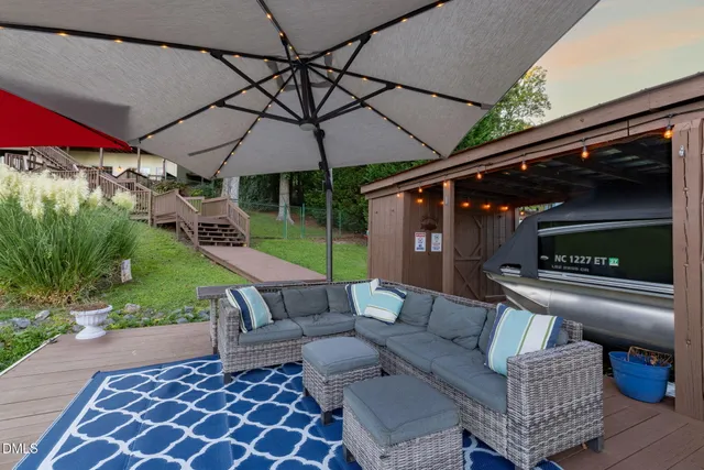 a view of a house with a backyard porch and sitting area