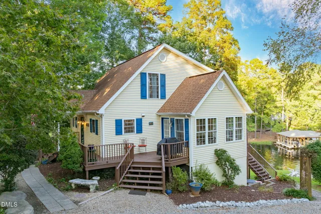 a spacious bedroom with a bed a couch and a window