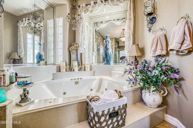 a white bath tub sitting next to a white sink