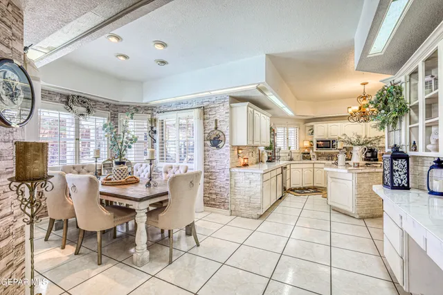 a kitchen with a sink appliances and cabinets