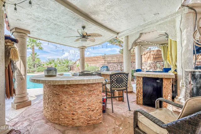 a view of a swimming pool with a yard