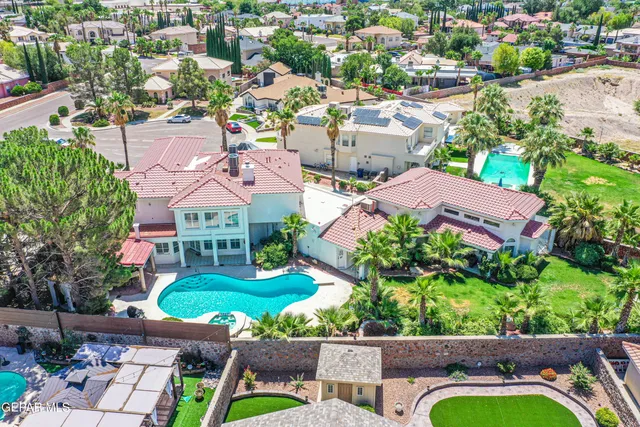 an aerial view of house with yard swimming pool and outdoor seating
