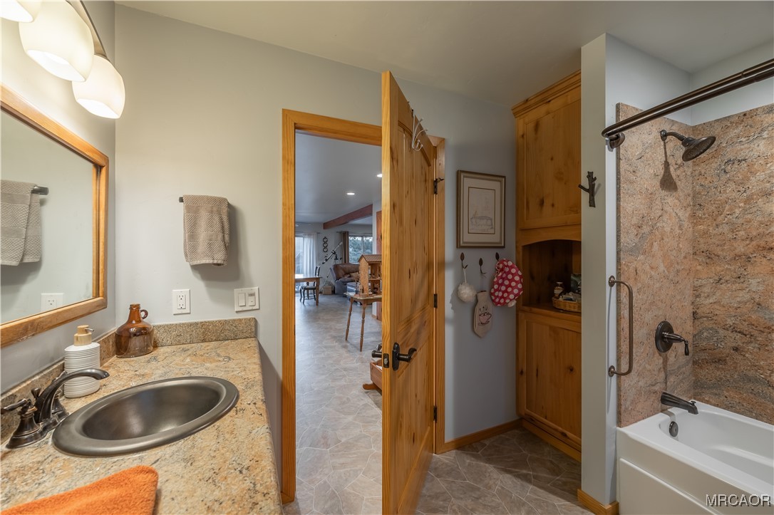 448 Edgemoor Road Big Bear Lake, CA 92315 - Photo 31 of 42 a bathroom with a sink tub vanity and shower