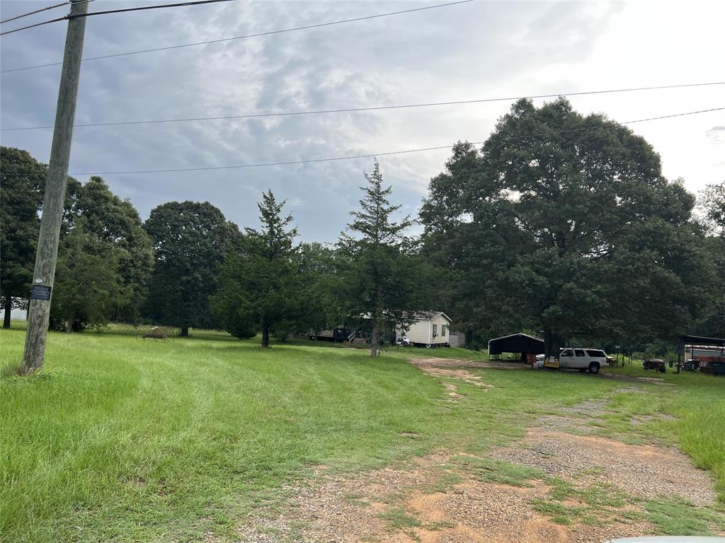 1533 Highway 171 Stonewall, LA 71078 - Photo 5 of 6 a view of outdoor space with deck and yard