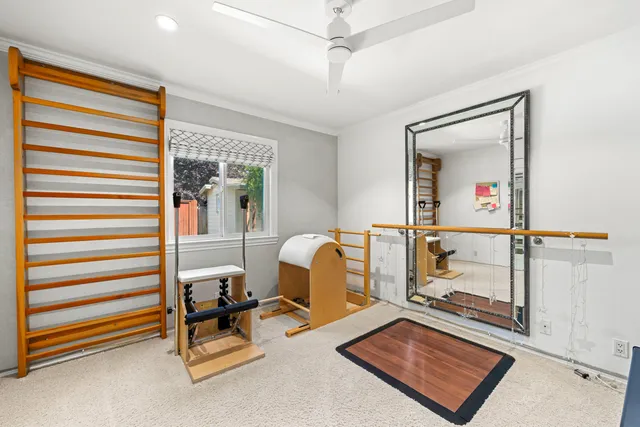 a room with gym equipment and a window