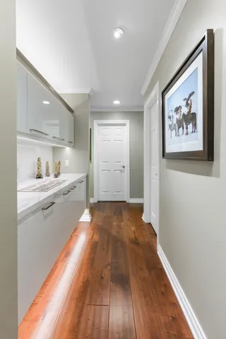 a view of a kitchen with wooden floor