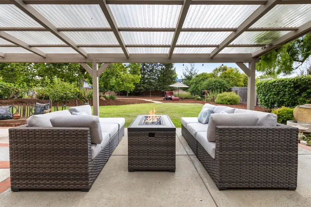 a view of a patio with couches chairs dining table and chairs