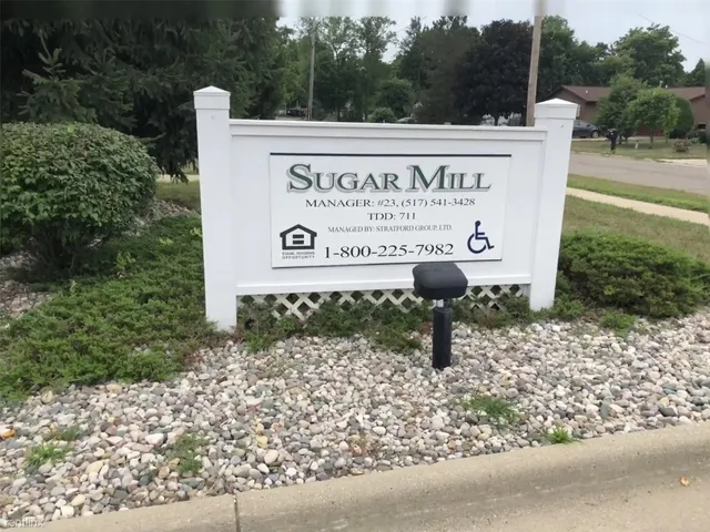 a sign on the side of the road