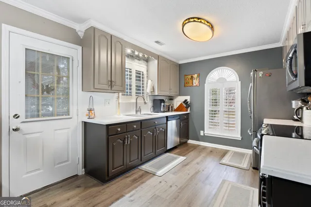 a spacious bathroom with a double vanity sink and a mirror