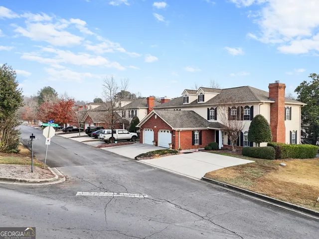 a view of multiple houses with a street