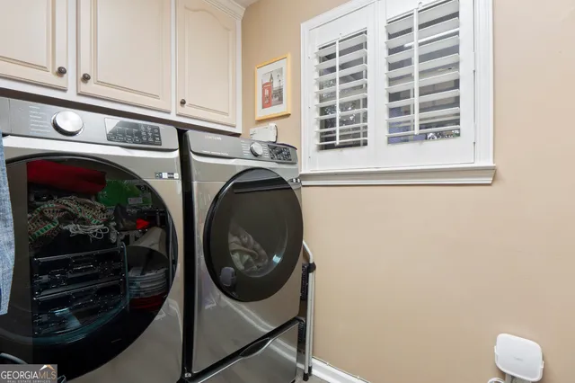 a utility room with dryer and washer