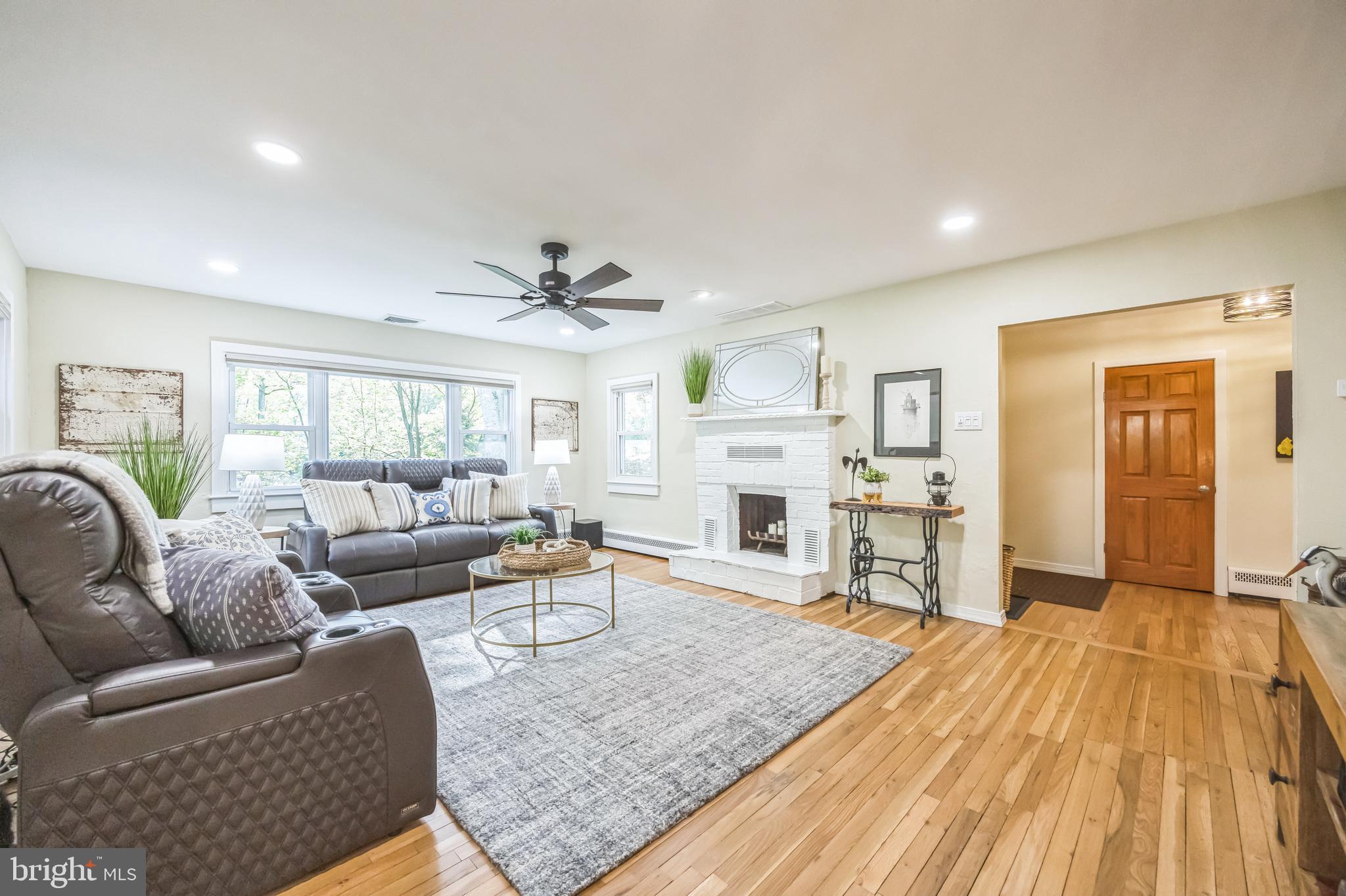 700 Pine Ridge Road Media, PA 19063 - Photo 17 of 50 a living room with furniture and a fireplace