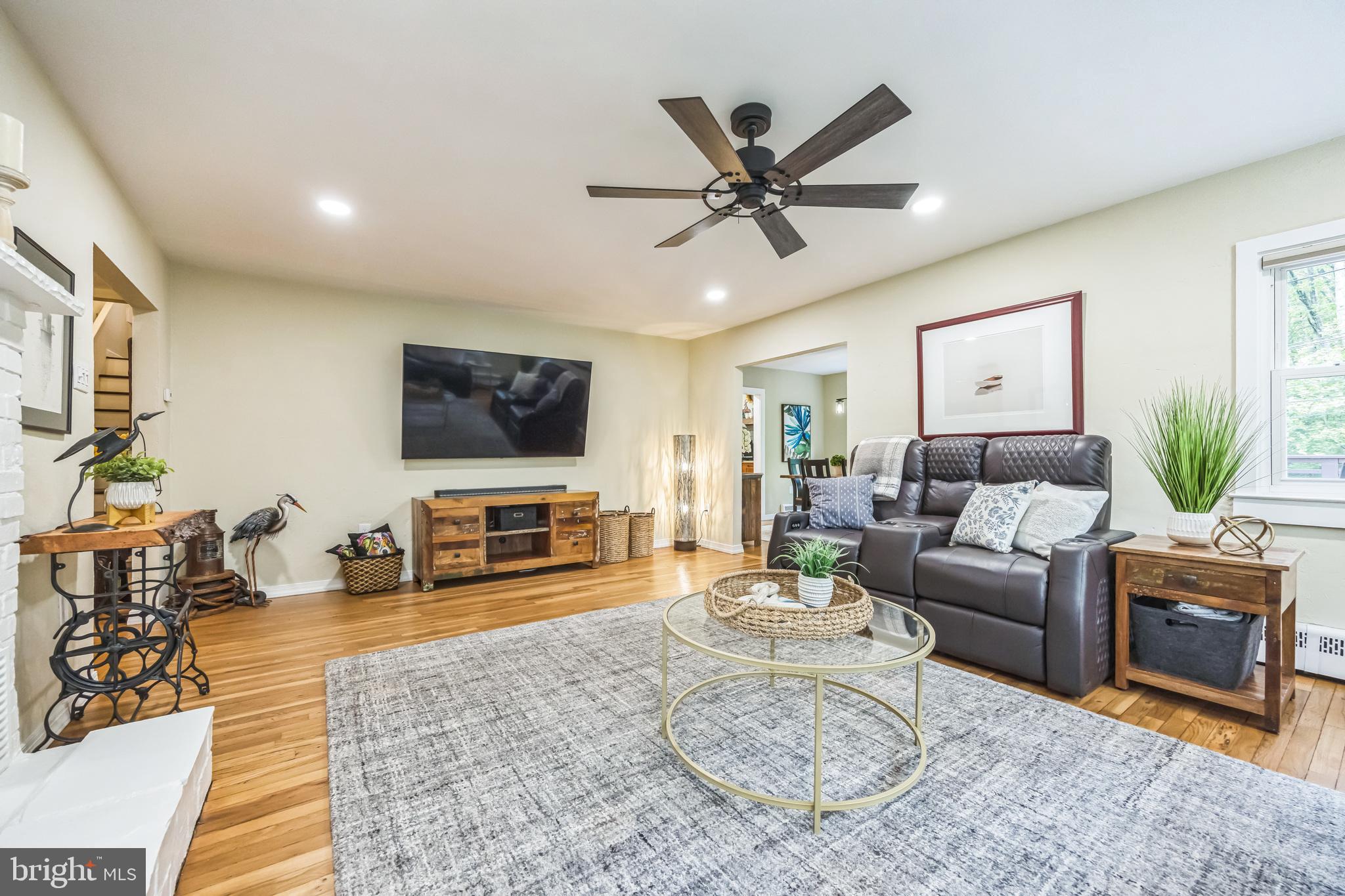 700 Pine Ridge Road Media, PA 19063 - Photo 18 of 50 a living room with furniture and a flat screen tv