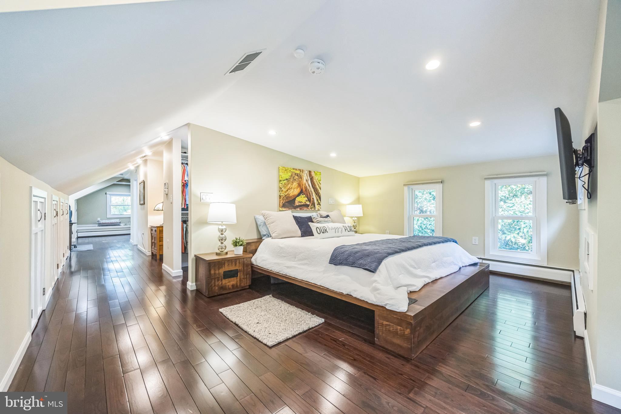 700 Pine Ridge Road Media, PA 19063 - Photo 27 of 50 a spacious bedroom with a bed and wooden floor