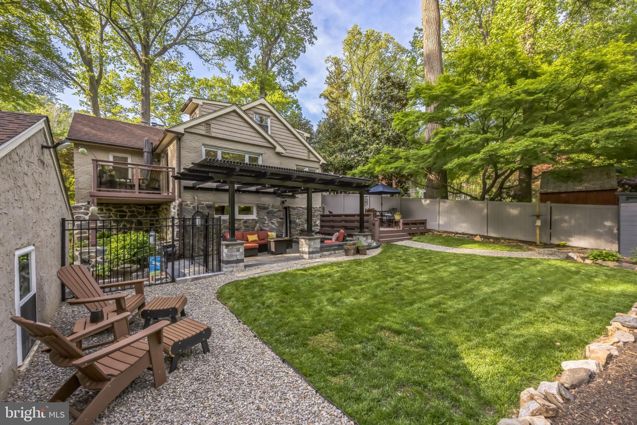 700 Pine Ridge Road Media, PA 19063 - Photo 3 of 50 a view of a patio with table and chairs and potted plants