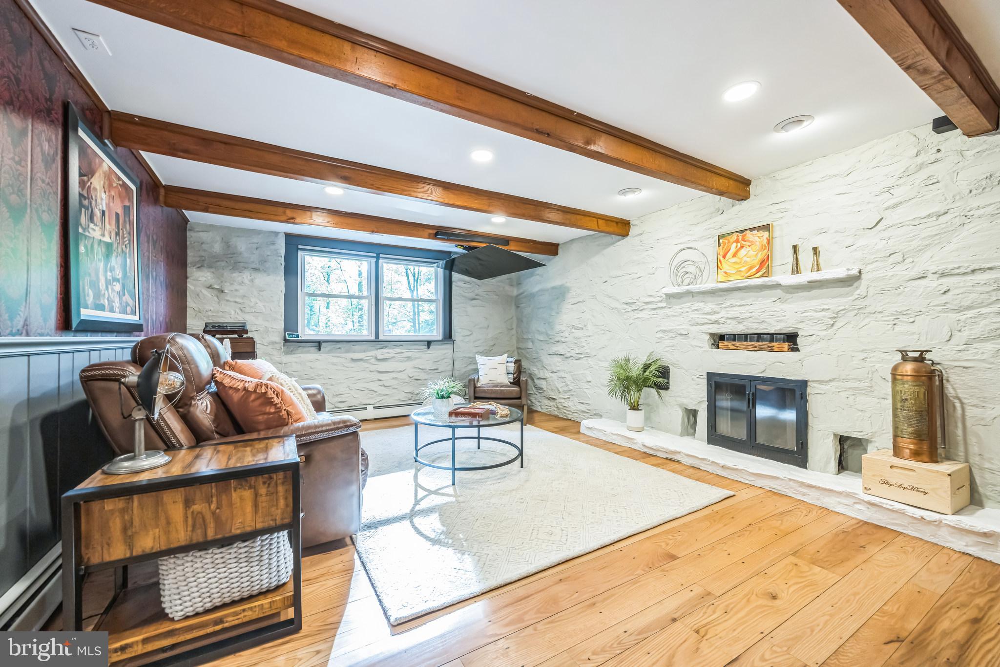 700 Pine Ridge Road Media, PA 19063 - Photo 39 of 50 a living room with furniture and a fireplace