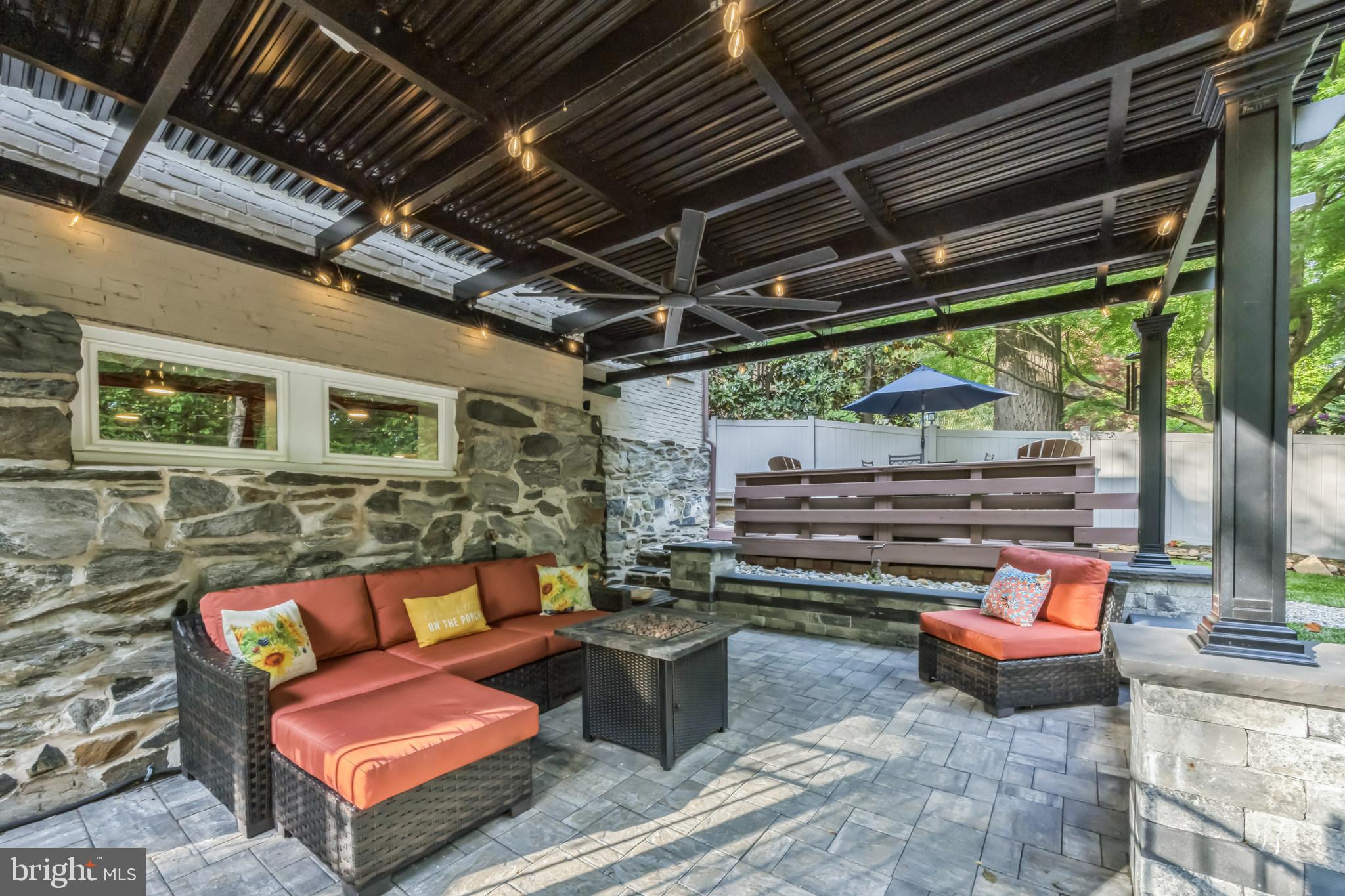 700 Pine Ridge Road Media, PA 19063 - Photo 4 of 50 a outdoor living space with patio furniture and a fireplace