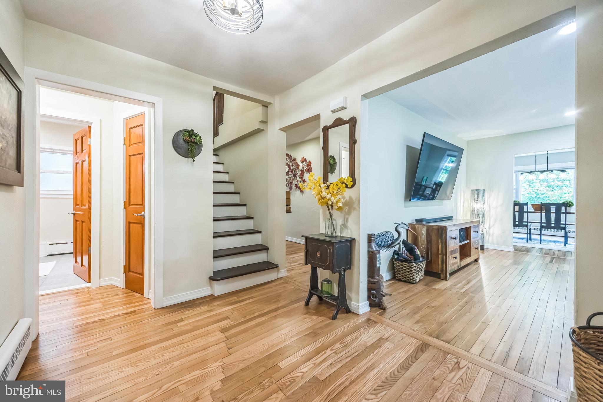 700 Pine Ridge Road Media, PA 19063 - Photo 5 of 50 a view of a living room and entryway with wooden floor