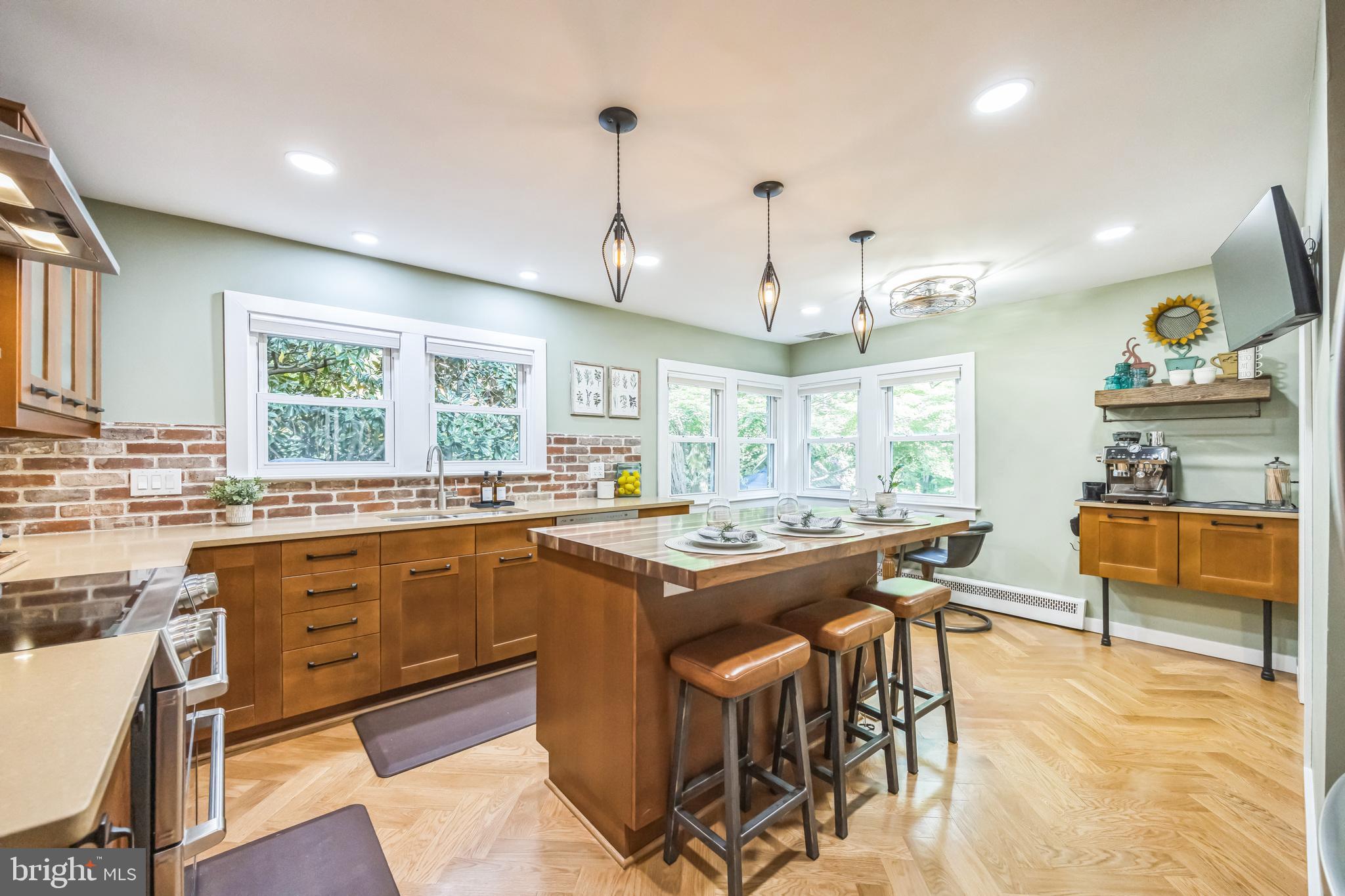 700 Pine Ridge Road Media, PA 19063 - Photo 7 of 50 a kitchen with stainless steel appliances granite countertop a stove and a refrigerator