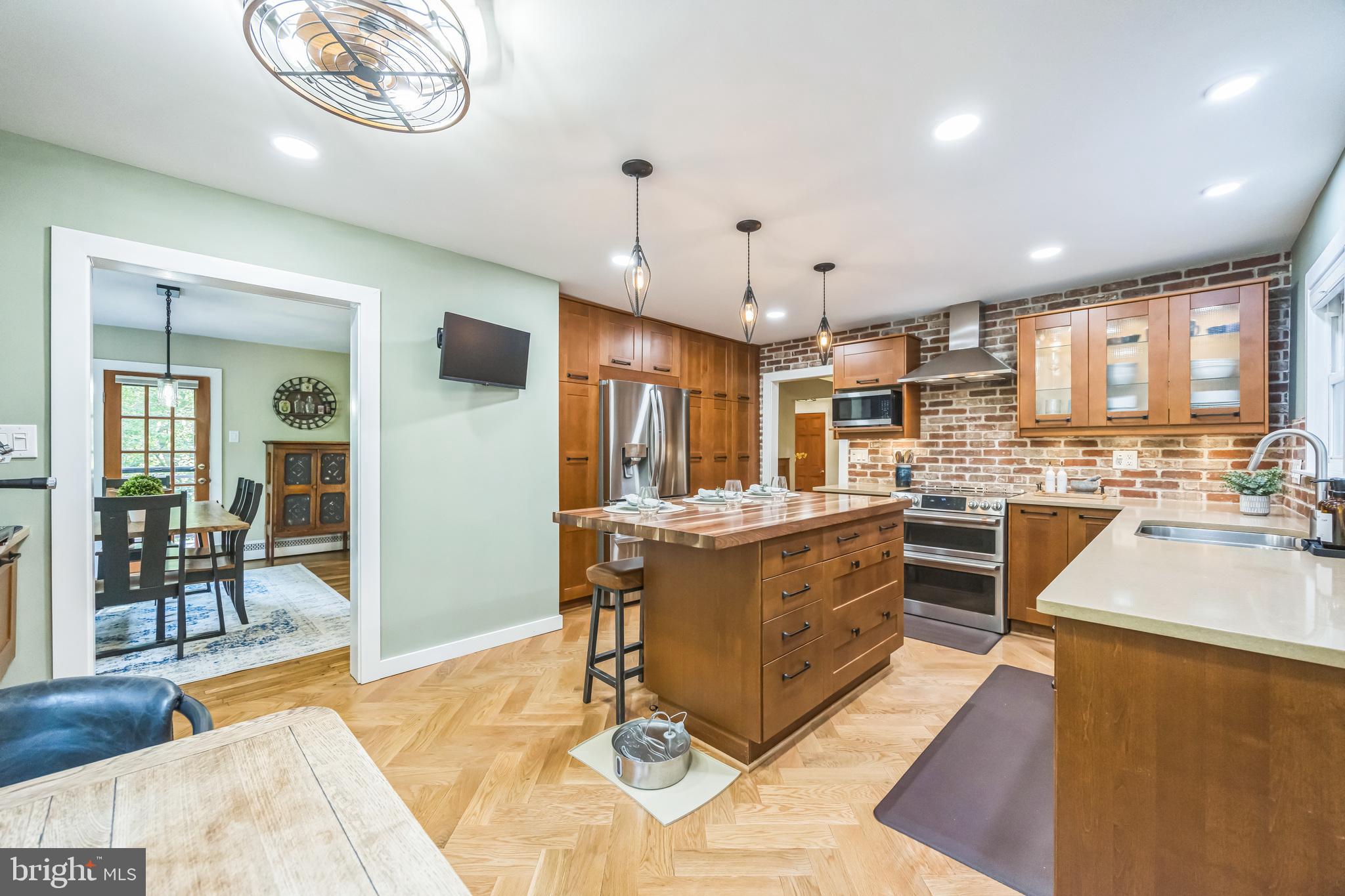 700 Pine Ridge Road Media, PA 19063 - Photo 8 of 50 a large kitchen with a table and chairs in it
