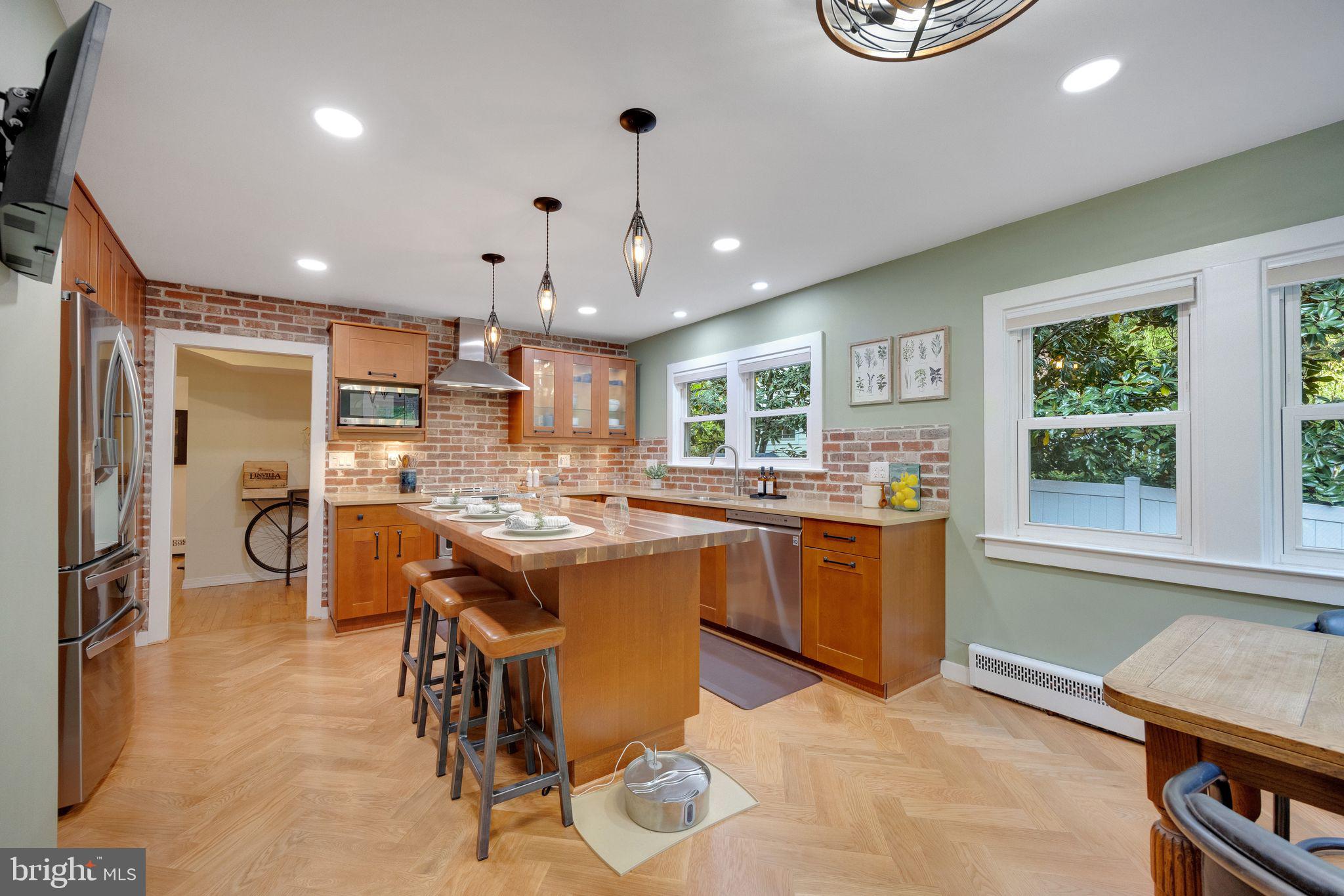 700 Pine Ridge Road Media, PA 19063 - Photo 9 of 50 a kitchen with kitchen island granite countertop lots of counter top space and stainless steel appliances