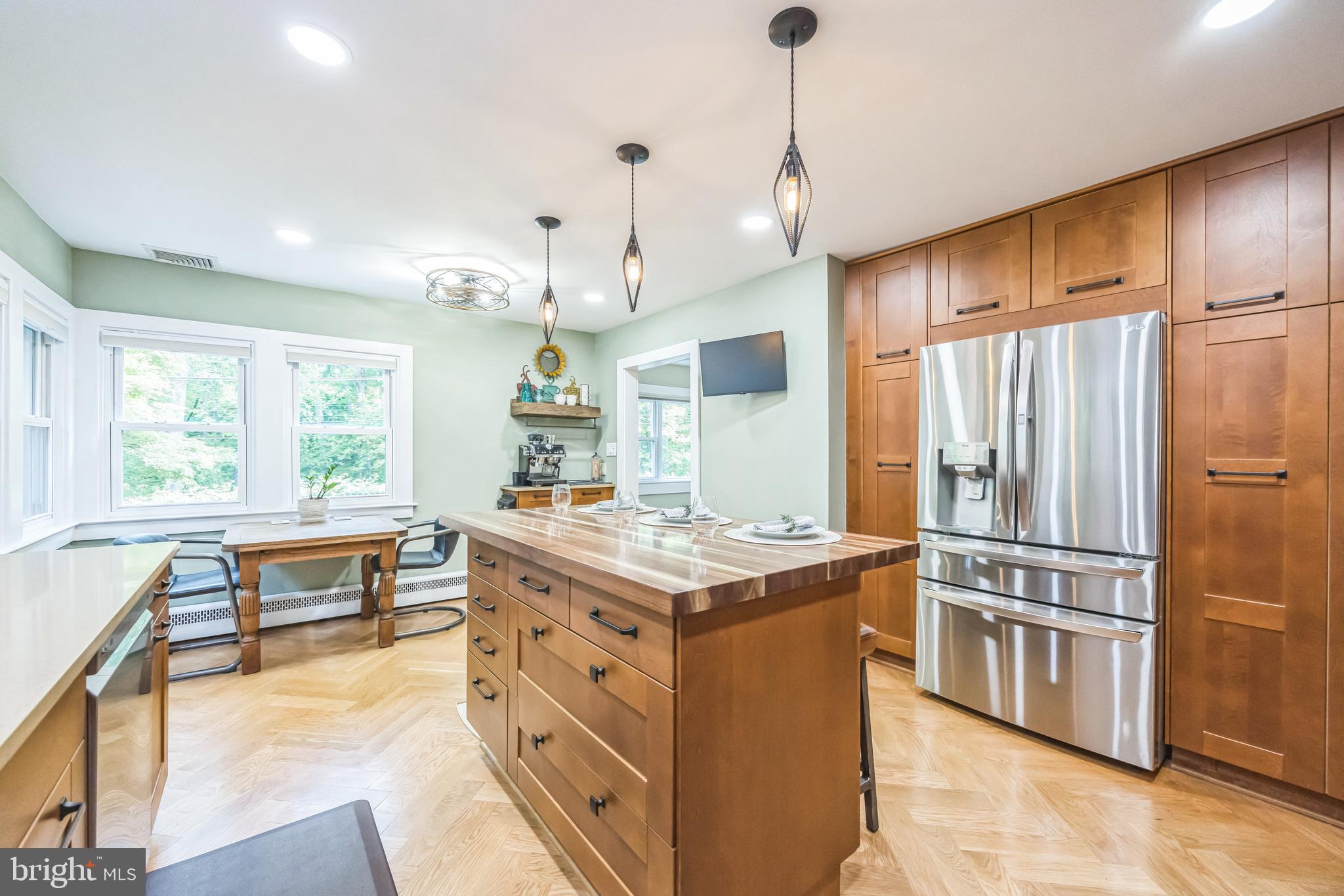 700 Pine Ridge Road Media, PA 19063 - Photo 10 of 50 a kitchen with kitchen island a stove a sink a oven and a refrigerator