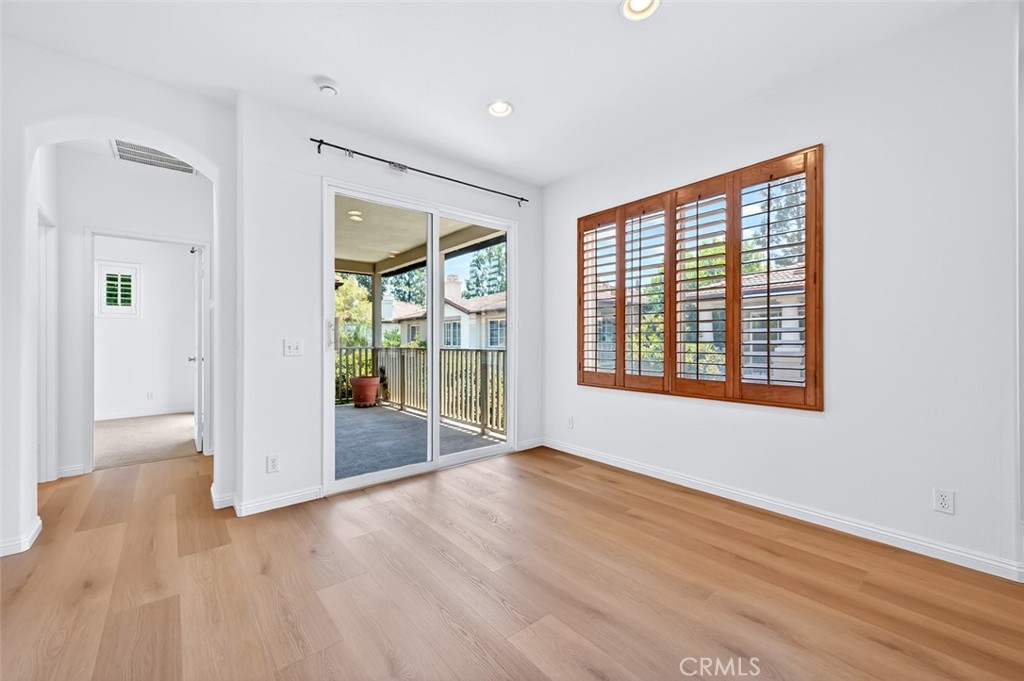 447 Ridgeway Irvine, CA 92620 - Photo 59 of 88 an empty room with wooden floor and windows