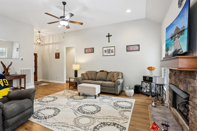 a living room with furniture and a fireplace