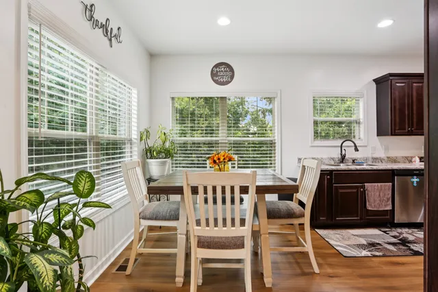a view of a dining room with furniture window and outside view