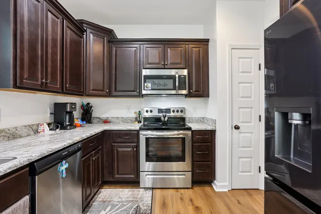 a kitchen with a stove and a microwave