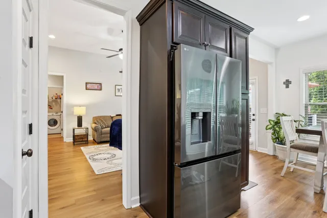 a kitchen with stainless steel appliances granite countertop a refrigerator and a sink