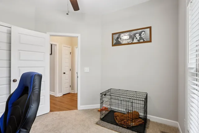 a bedroom with furniture and a window